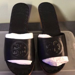 Brand new. Black Tory Burch wedge sandal.
